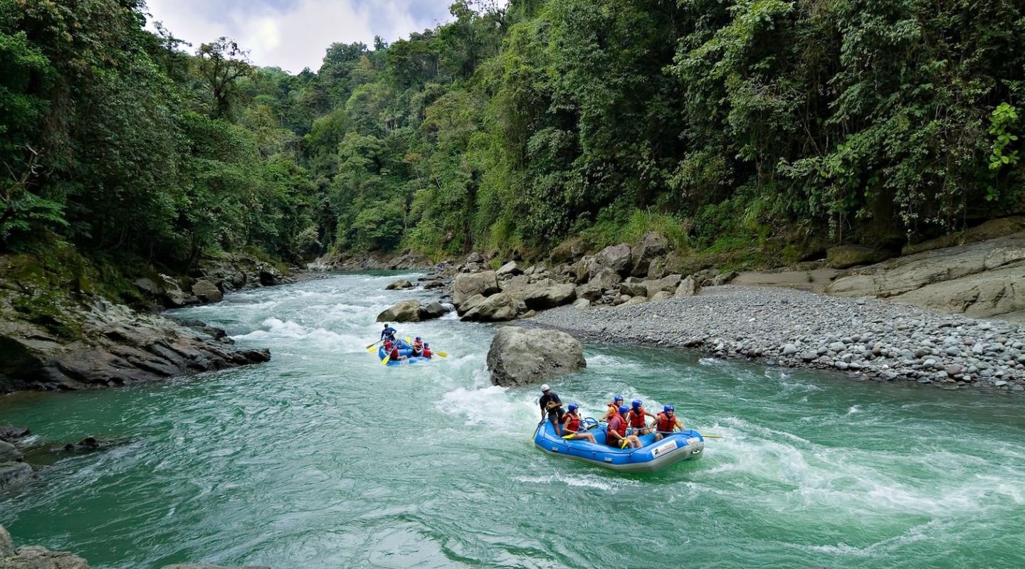 Rafting towards Pacuare Lodge, popular for family adventures in Latin America.