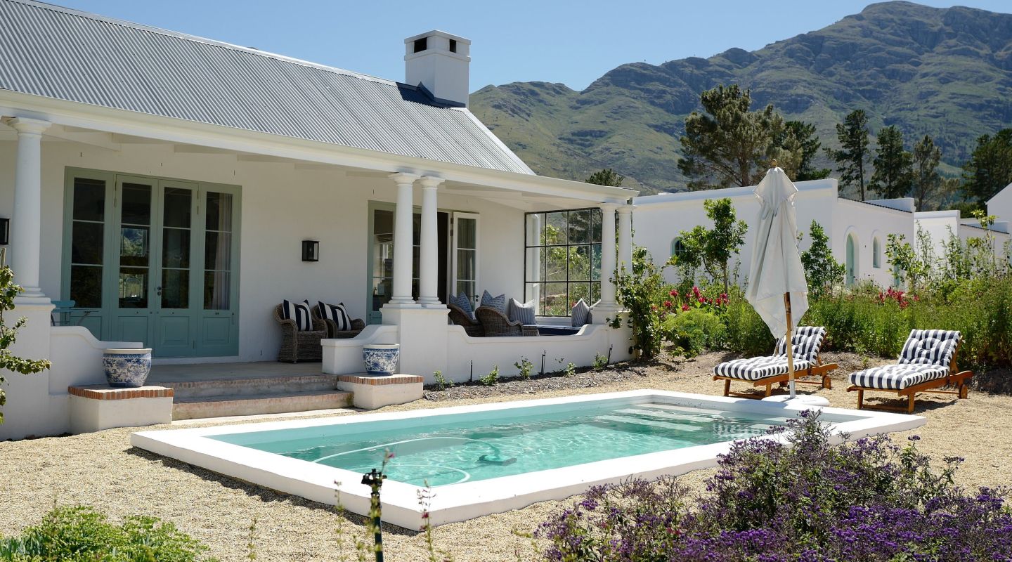 Historic La Cotte cottage surrounded by vineyards in Winelands South Africa